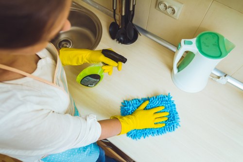 Professional sofa cleaning removes dust and stains from a fabric couch