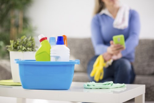Cleaner vacuuming carpets during end of tenancy cleaning