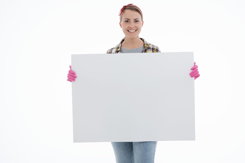A bright yellow paper torn open to reveal a white surface with the text 'Discount Price' typed in black. The torn edges of the paper create a jagged border around the message, and the background is al